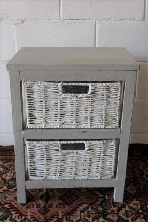 An awesome grey wooden 2-drawer pedestal with white wicker drawers - great in the bathroom