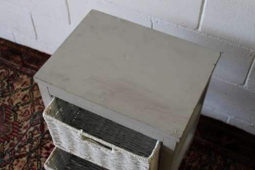 An awesome grey wooden 2-drawer pedestal with white wicker drawers - great in the bathroom