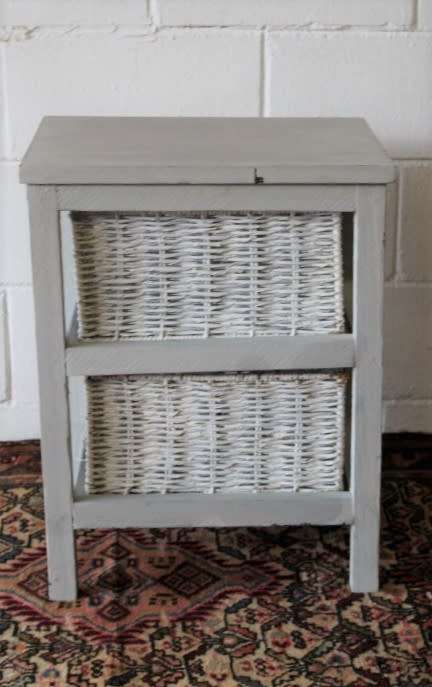 An awesome grey wooden 2-drawer pedestal with white wicker drawers - great in the bathroom