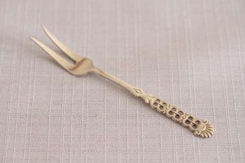 A wonderful antique European Art Deco 830S solid silver 2-prong shellfish fork with ornate detailing