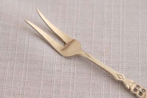 A wonderful antique European Art Deco 830S solid silver 2-prong shellfish fork with ornate detailing