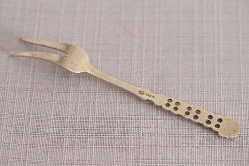 A wonderful antique European Art Deco 830S solid silver 2-prong shellfish fork with ornate detailing