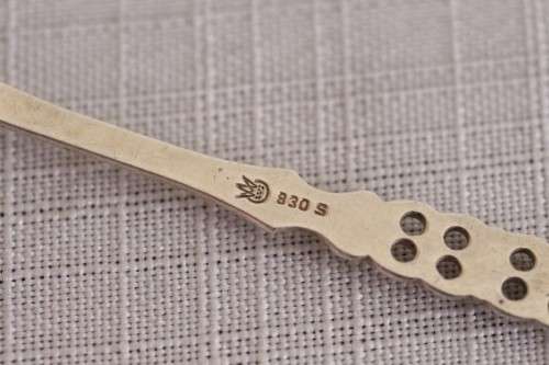 A wonderful antique European Art Deco 830S solid silver 2-prong shellfish fork with ornate detailing