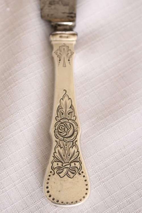 An incredible antique (c1910) Swedish made 830S solid silver knife with ornate detailing
