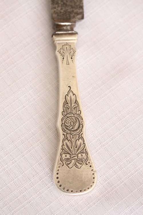 An incredible antique (c1910) Swedish made 830S solid silver knife with ornate detailing