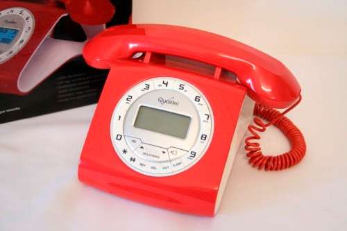 An awesome Qualitel Retro corded telephone with caller ID and speaker phone in its box.