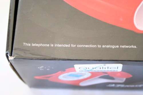 An awesome Qualitel Retro corded telephone with caller ID and speaker phone in its box.