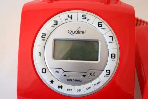 An awesome Qualitel Retro corded telephone with caller ID and speaker phone in its box.