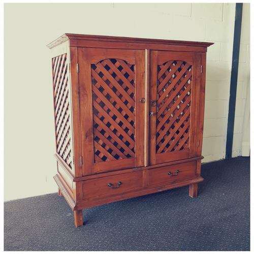A wonderful Balinese Teak entertainment cabinet with fold-back doors and two drawers - stunning!!