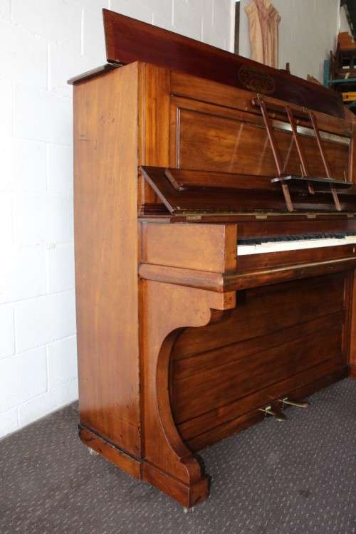 A spectacular antique Edwardian "John Brinsmead & Sons" upright piano - elegant addition to a lounge