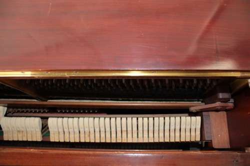A spectacular antique Edwardian "John Brinsmead & Sons" upright piano - elegant addition to a lounge
