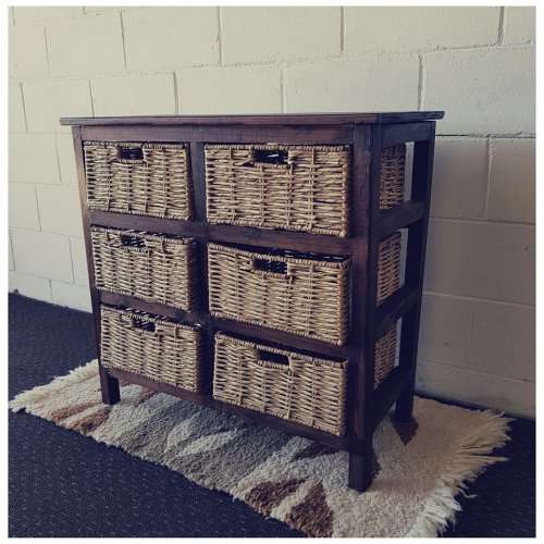 An awesome dark wooden 6-drawer cabinet with wicker drawers - great in the bathroom or bedroom!