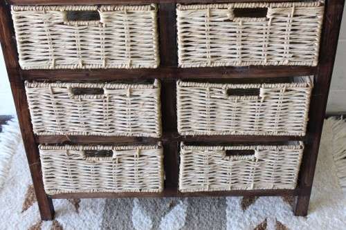 An awesome dark wooden 6-drawer cabinet with wicker drawers - great in the bathroom or bedroom!