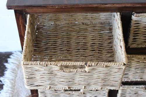 An awesome dark wooden 6-drawer cabinet with wicker drawers - great in the bathroom or bedroom!