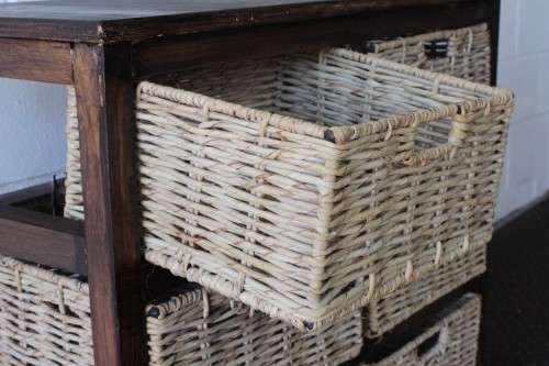 An awesome dark wooden 6-drawer cabinet with wicker drawers - great in the bathroom or bedroom!