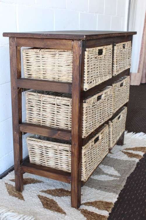 An awesome dark wooden 6-drawer cabinet with wicker drawers - great in the bathroom or bedroom!