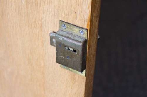 A lovely Oak single-door corner cabinet with shelves on the inside. Perfect for smaller spaces!!