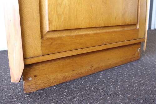 A lovely Oak single-door corner cabinet with shelves on the inside. Perfect for smaller spaces!!