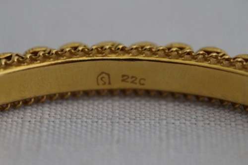 A magnificent solid 22ct gold ladies bangle w/ intricate detailing in awesome condition price/bangle