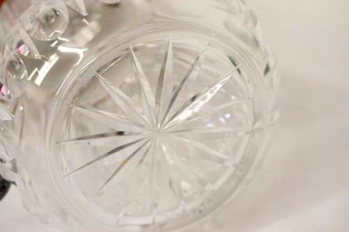 A spectacular lead crystal water jug with a cooler for ice, brass lid and handle in good condition