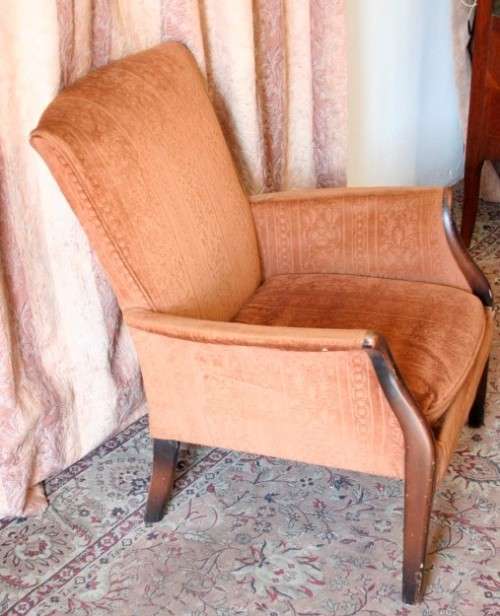 A gorgeous vintage upholstered arm chair, fantastic in a sun room, patio or on a porch!