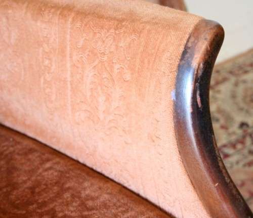 A gorgeous vintage upholstered arm chair, fantastic in a sun room, patio or on a porch!