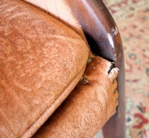 A gorgeous vintage upholstered arm chair, fantastic in a sun room, patio or on a porch!