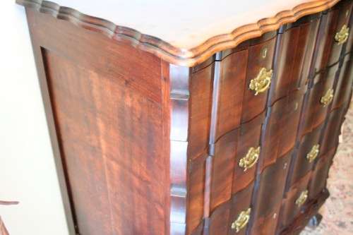 An exquisite vintage Imbuia 5-drawer chest of drawers with ornate handles and ample storage space