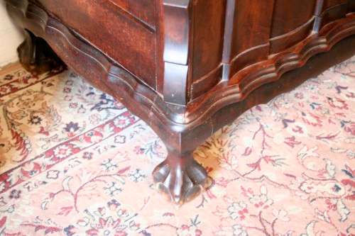 An exquisite vintage Imbuia 5-drawer chest of drawers with ornate handles and ample storage space