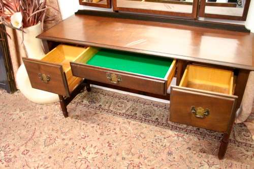 An exquisite three-drawer Imbuia dressing table with side-folding mirrors and a stool