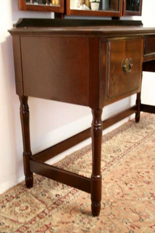 An exquisite three-drawer Imbuia dressing table with side-folding mirrors and a stool