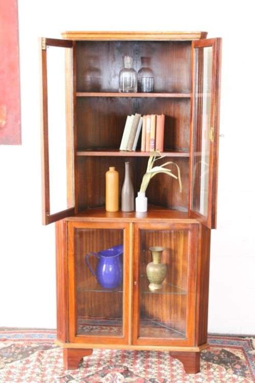 A fabulous and beautifully made 2-division corner display unit cabinet with ample shelves and space
