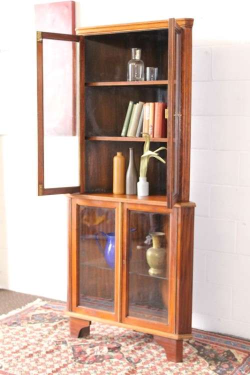 A fabulous and beautifully made 2-division corner display unit cabinet with ample shelves and space