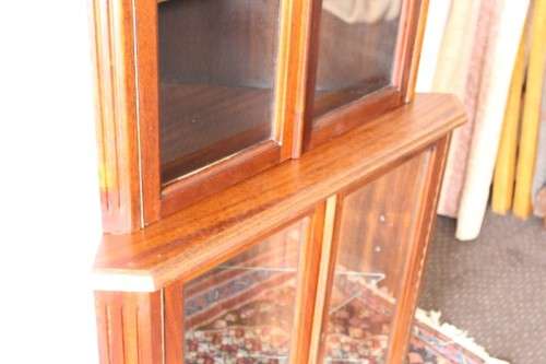 A fabulous and beautifully made 2-division corner display unit cabinet with ample shelves and space