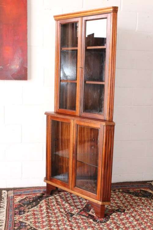 A fabulous and beautifully made 2-division corner display unit cabinet with ample shelves and space