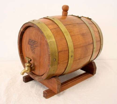 A fabulous small vintage solid Oak wine barrel with its original brass hoops, tap and stand!