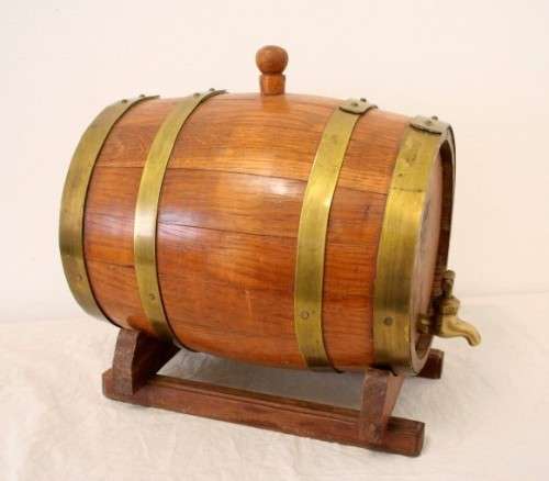 A fabulous small vintage solid Oak wine barrel with its original brass hoops, tap and stand!