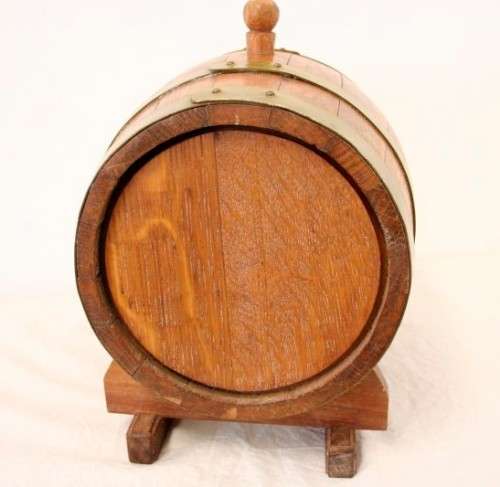 A fabulous small vintage solid Oak wine barrel with its original brass hoops, tap and stand!