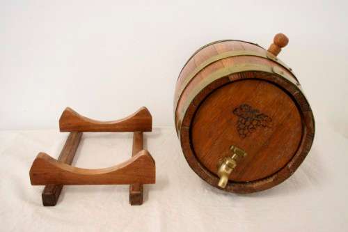 A fabulous small vintage solid Oak wine barrel with its original brass hoops, tap and stand!