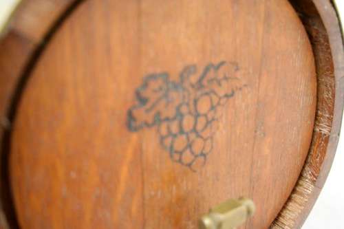 A fabulous small vintage solid Oak wine barrel with its original brass hoops, tap and stand!