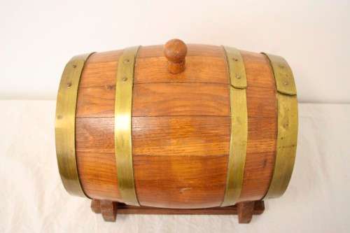A fabulous small vintage solid Oak wine barrel with its original brass hoops, tap and stand!