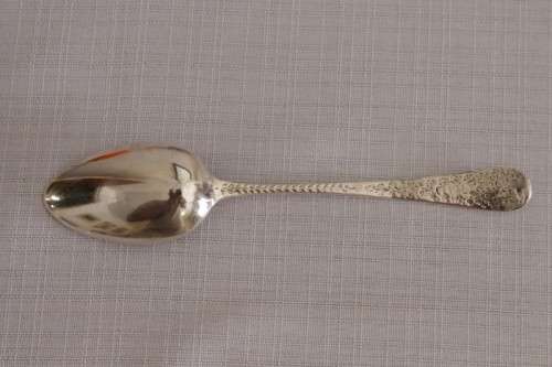 A fabulous ornate antique Georgian (1810) British made and hallmarked sterling silver spoon
