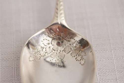 A fabulous ornate antique Georgian (1810) British made and hallmarked sterling silver spoon
