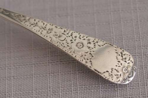 A fabulous ornate antique Georgian (1810) British made and hallmarked sterling silver spoon