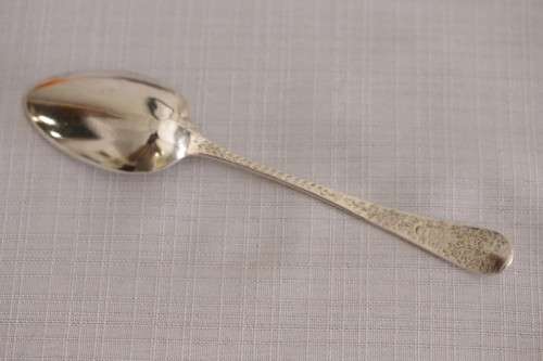 A fabulous ornate antique Georgian (1810) British made and hallmarked sterling silver spoon