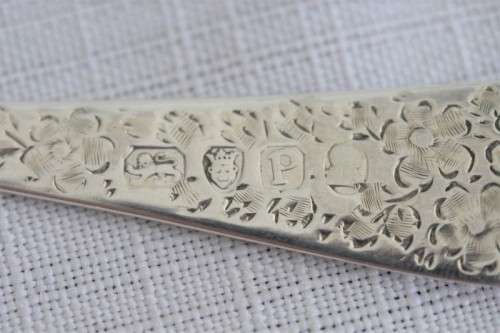 A fabulous ornate antique Georgian (1810) British made and hallmarked sterling silver spoon