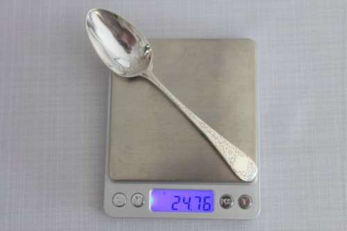 A fabulous ornate antique Georgian (1810) British made and hallmarked sterling silver spoon