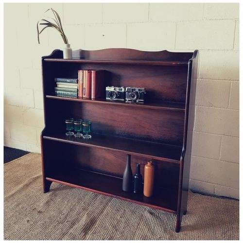 A stunning and spacious teak bookshelf with three shelves - perfect to display collectables as well!