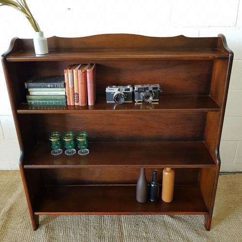 A stunning and spacious teak bookshelf with three shelves - perfect to display collectables as well!