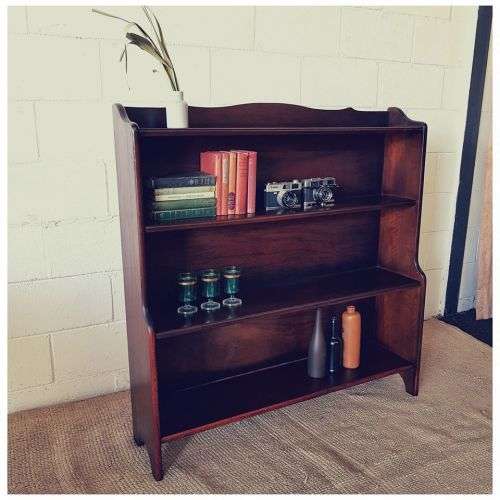 A stunning and spacious teak bookshelf with three shelves - perfect to display collectables as well!